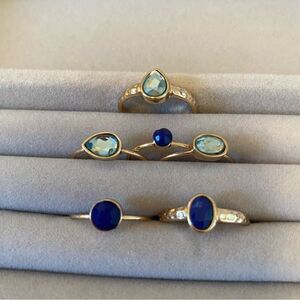 Set of 6 Thin Gold Toned Faux Gemstone Rings. 3 are Dark Blue & 3 are Lt. Blue